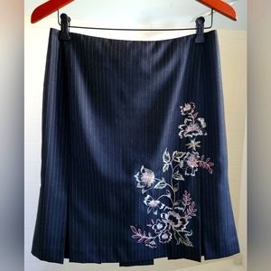 Knee-length pin stripped black skirt